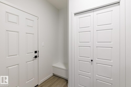 Mudroom with light wood-style floors and baseboards - 75 Dansereau Way, Beaumont, AB - Indoor Photo Showing Other Room