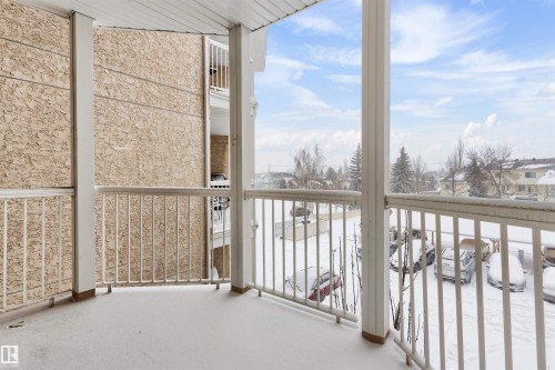 View of snow covered back of property - 312 11620 9A Avenue, Edmonton, AB - Outdoor With Balcony With Exterior