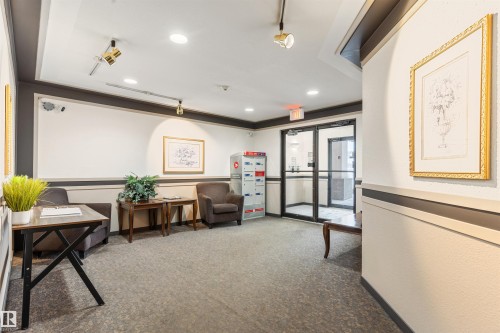 Community lobby with recessed lighting and crown molding - 312 11620 9A Avenue, Edmonton, AB - Indoor Photo Showing Other Room