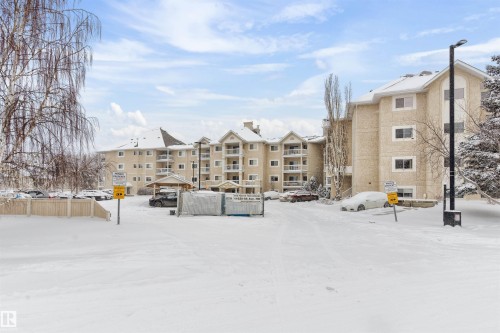 Snow covered building featuring a view of apartment building / complex - 312 11620 9A Avenue, Edmonton, AB - Outdoor With Facade
