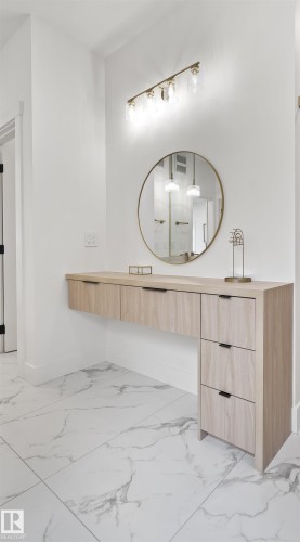 Bathroom featuring vanity and light marble finish flooring - 7026 Kiviaq Crescent, Edmonton, AB - Indoor