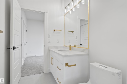 Half bath featuring vanity and light colored carpet - 7026 Kiviaq Crescent, Edmonton, AB - Indoor Photo Showing Bathroom