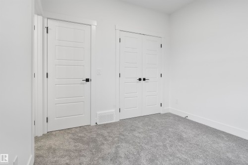 Unfurnished bedroom featuring carpet flooring and a closet - 7026 Kiviaq Crescent, Edmonton, AB - Indoor Photo Showing Other Room