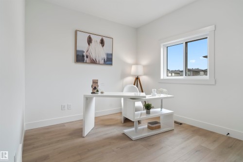 Office area featuring light wood-style floors and baseboards - 7026 Kiviaq Crescent, Edmonton, AB - Indoor