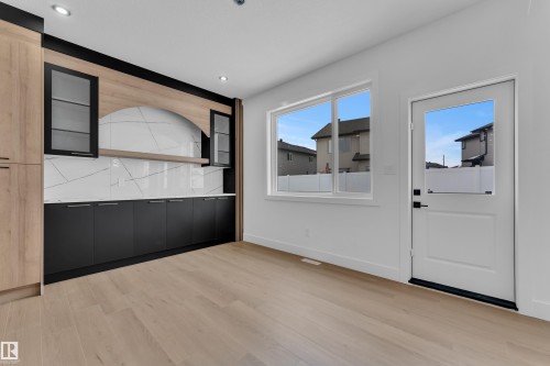 Unfurnished dining area with light wood-style flooring and recessed lighting - 741 Astoria Way, Devon, AB - Indoor Photo Showing Other Room