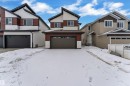 View of front of home featuring a garage - 741 Astoria Way, Devon, AB  - Outdoor With Facade 