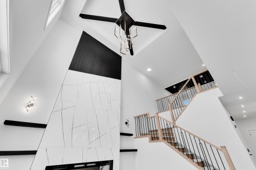 Stairway featuring a high ceiling and recessed lighting - 741 Astoria Way, Devon, AB - Indoor Photo Showing Other Room