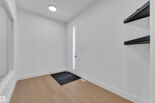 Entrance foyer with light wood-style flooring and baseboards - 741 Astoria Way, Devon, AB - Indoor Photo Showing Other Room