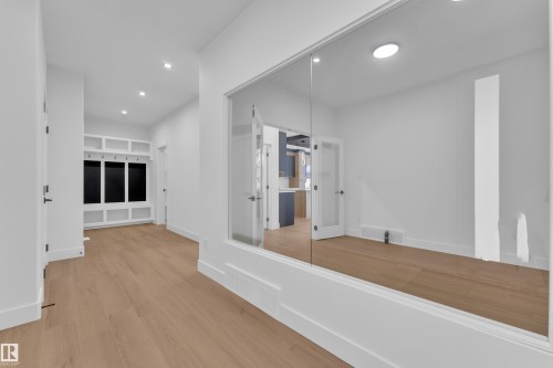 Hallway featuring light wood-type flooring and recessed lighting - 741 Astoria Way, Devon, AB - Indoor Photo Showing Other Room
