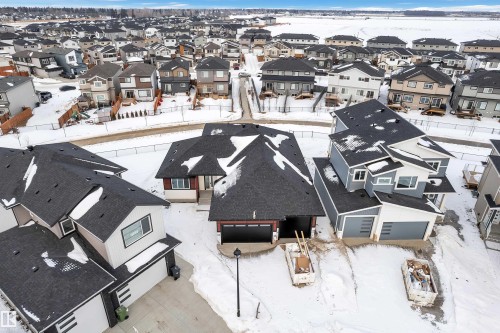 Snowy aerial view with a residential view - 215 Basin Court, Leduc, AB - Outdoor
