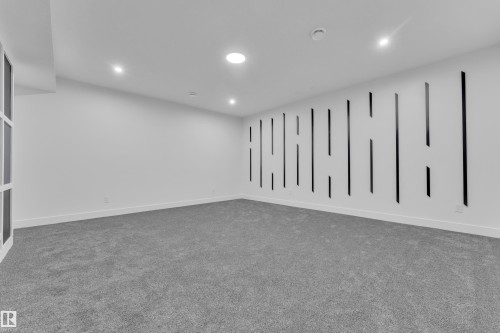 Unfurnished room featuring carpet floors and recessed lighting - 215 Basin Court, Leduc, AB - Indoor Photo Showing Other Room