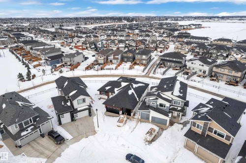 Snowy aerial view with a residential view - 215 Basin Court, Leduc, AB - Outdoor With View