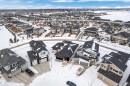 Snowy aerial view with a residential view - 215 Basin Court, Leduc, AB  - Outdoor With View 
