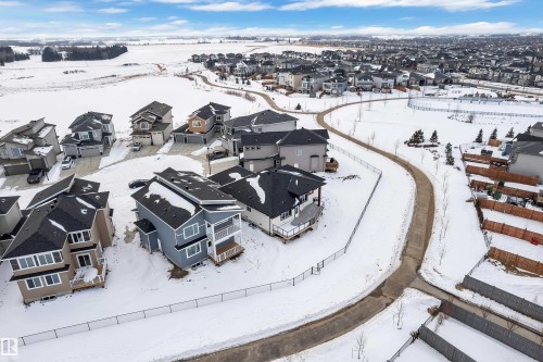 Snowy aerial view with a residential view - 215 Basin Court, Leduc, AB - Outdoor With View