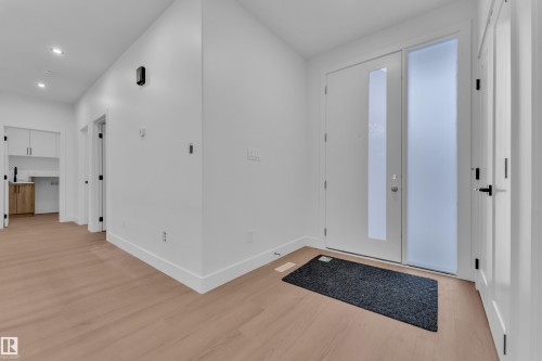 Entryway featuring light wood-style flooring and recessed lighting - 215 Basin Court, Leduc, AB - Indoor Photo Showing Other Room