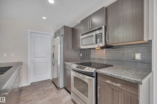 415 Simmonds Way, Leduc, AB - Indoor Photo Showing Kitchen With Double Sink