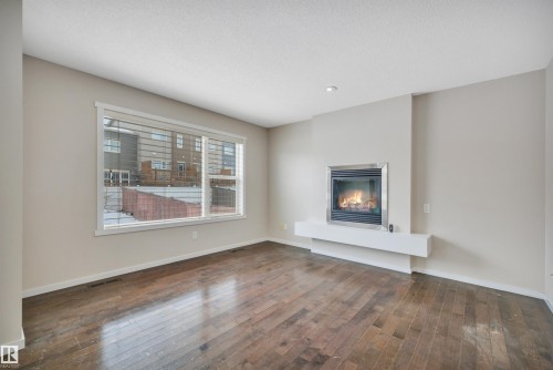 415 Simmonds Way, Leduc, AB - Indoor Photo Showing Living Room With Fireplace