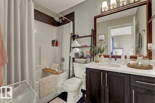 Bathroom with vanity and shower / bath combo - 10806 72 Avenue, Edmonton, AB - Indoor Photo Showing Bathroom