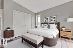 Bedroom featuring dark wood-type flooring, lofted ceiling, and a closet - 