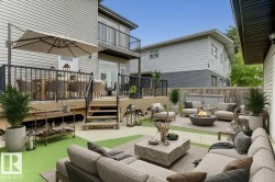 Wooden terrace with an outdoor living space with a fire pit and a patio area - 