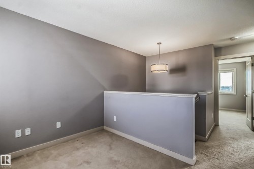 Carpeted spare room with baseboards - 1669 Hammond Crescent, Edmonton, AB - Indoor Photo Showing Other Room