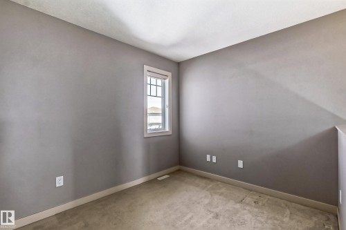Spare room with baseboards and light colored carpet - 1669 Hammond Crescent, Edmonton, AB - Indoor Photo Showing Other Room