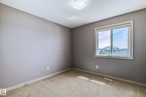 Carpeted spare room with baseboards - 1669 Hammond Crescent, Edmonton, AB - Indoor Photo Showing Other Room