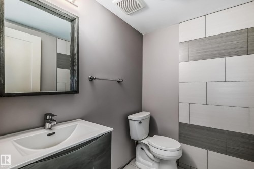 Bathroom featuring vanity and toilet - 1669 Hammond Crescent, Edmonton, AB - Indoor Photo Showing Bathroom