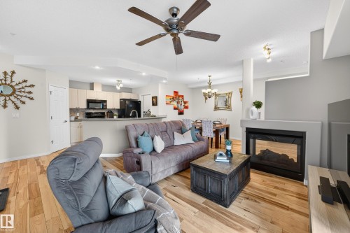 307 5280 Terwillegar Boulevard, Edmonton, AB - Indoor Photo Showing Living Room With Fireplace