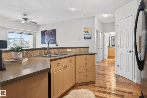 307 5280 Terwillegar Boulevard, Edmonton, AB - Indoor Photo Showing Kitchen With Double Sink