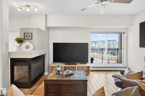 307 5280 Terwillegar Boulevard, Edmonton, AB - Indoor Photo Showing Living Room With Fireplace