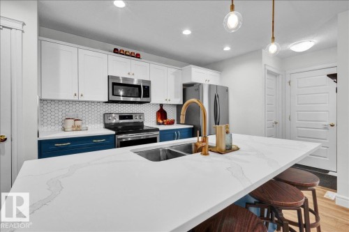 6489 King Wynd, Edmonton, AB - Indoor Photo Showing Kitchen With Stainless Steel Kitchen With Double Sink With Upgraded Kitchen