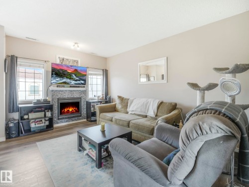 94 13825 155 Avenue, Edmonton, AB - Indoor Photo Showing Living Room With Fireplace