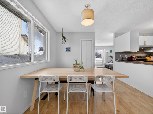Dining area featuring light wood-style floors and breakfast area - 4603 32 Avenue, Edmonton, AB - Indoor Photo Showing Dining Room
