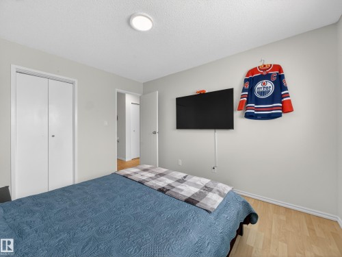 Bedroom featuring light wood finished floors and a textured ceiling - 4603 32 Avenue, Edmonton, AB - Indoor Photo Showing Bedroom