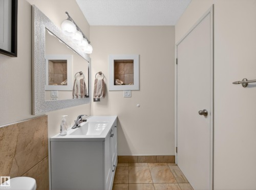 Bathroom featuring vanity and a textured ceiling - 4603 32 Avenue, Edmonton, AB - Indoor