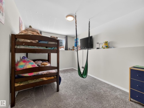 Bedroom featuring baseboards and light colored carpet - 4603 32 Avenue, Edmonton, AB - Indoor Photo Showing Bedroom