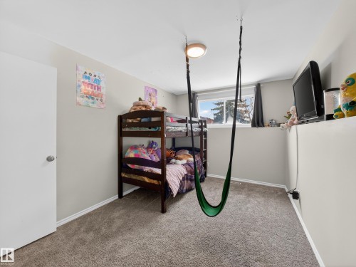 Bedroom with light carpet and baseboards - 4603 32 Avenue, Edmonton, AB - Indoor