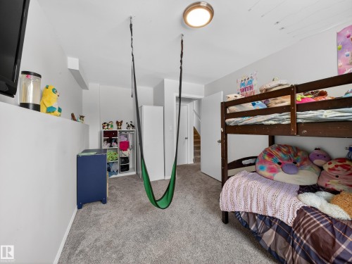 Bedroom with light carpet - 4603 32 Avenue, Edmonton, AB - Indoor Photo Showing Bedroom