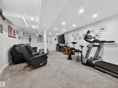 Workout room with recessed lighting and light colored carpet - 4603 32 Avenue, Edmonton, AB - Indoor Photo Showing Gym Room
