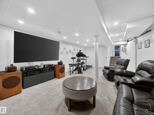 Living room with light carpet and recessed lighting - 4603 32 Avenue, Edmonton, AB - Indoor