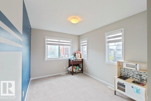 Playroom with light carpet and plenty of natural light - 4303 Prowse Link, Edmonton, AB - Indoor