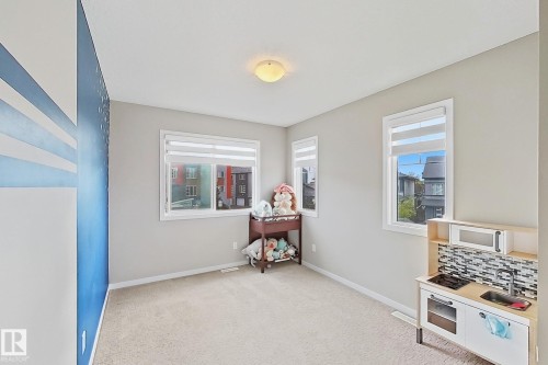 Game room with baseboards and light colored carpet - 4303 Prowse Link, Edmonton, AB - Indoor