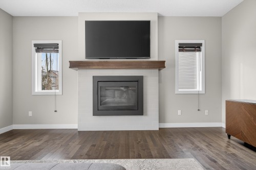 3333 West Court, Edmonton, AB - Indoor Photo Showing Living Room With Fireplace