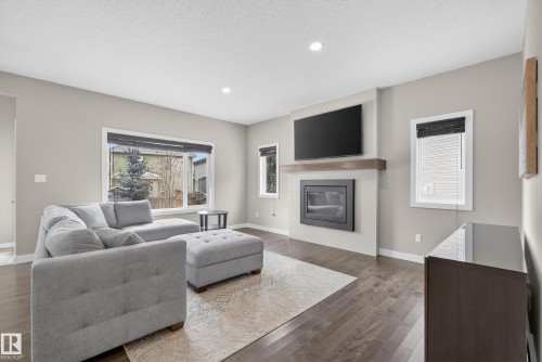 3333 West Court, Edmonton, AB - Indoor Photo Showing Living Room With Fireplace