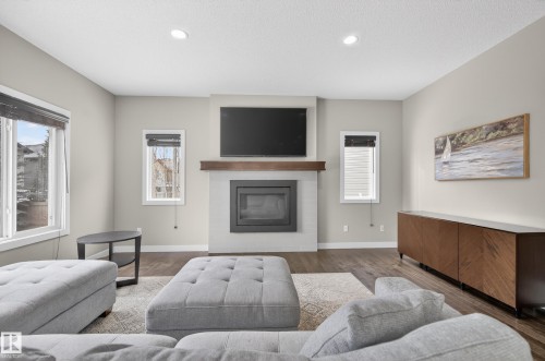 3333 West Court, Edmonton, AB - Indoor Photo Showing Living Room With Fireplace