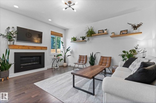 5432 Allbright Square, Edmonton, AB - Indoor Photo Showing Living Room With Fireplace