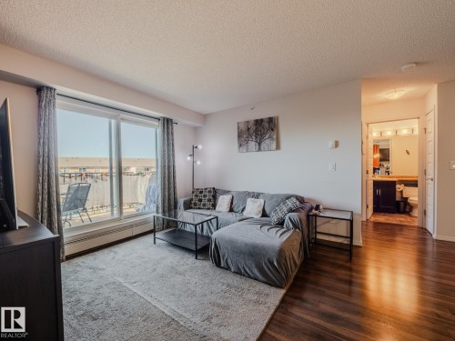 409 6070 Schonsee Way, Edmonton, AB - Indoor Photo Showing Living Room