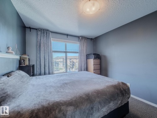 409 6070 Schonsee Way, Edmonton, AB - Indoor Photo Showing Bedroom