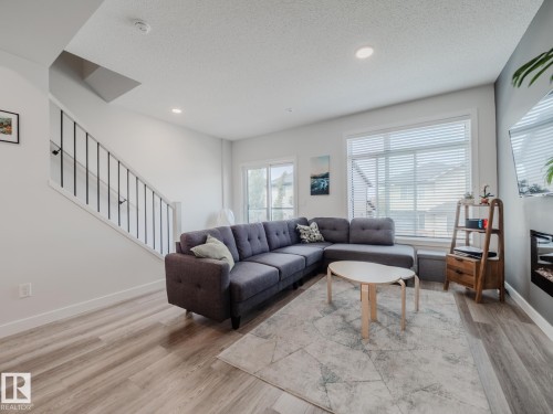 21 1010 Rabbit Hill Road, Edmonton, AB - Indoor Photo Showing Living Room With Fireplace